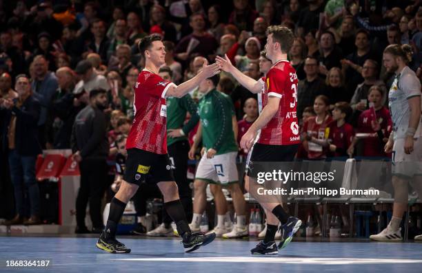 Hans Lindberg and Hakun West av Teigum of the Fuechsen Berlin celebrate the win after the game between Fuechse Berlin and SC DHfK Leipzig at...