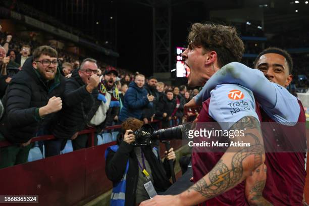 Nicolo Zaniolo of Aston Villa celebrates scoring his late equalising goal with the fans during the Premier League match between Aston Villa and...