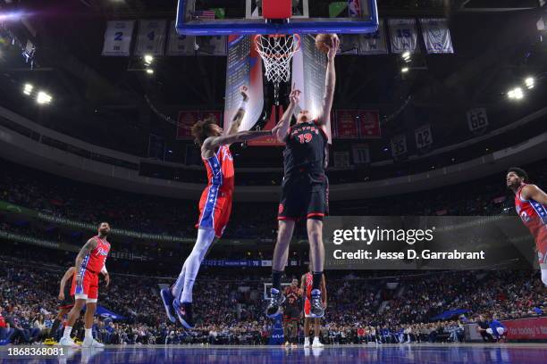 Jakob Poeltl of the Toronto Raptors drives to the basket during the game against the Philadelphia 76ers on December 22, 2023 at the Wells Fargo...