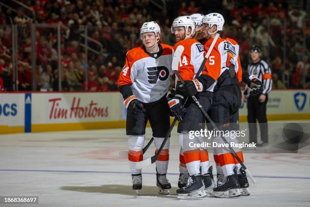 Sean Couturier of the Philadelphia Flyers celebrates his goal with teammates during the second period of the game against the Detroit Red Wings at...