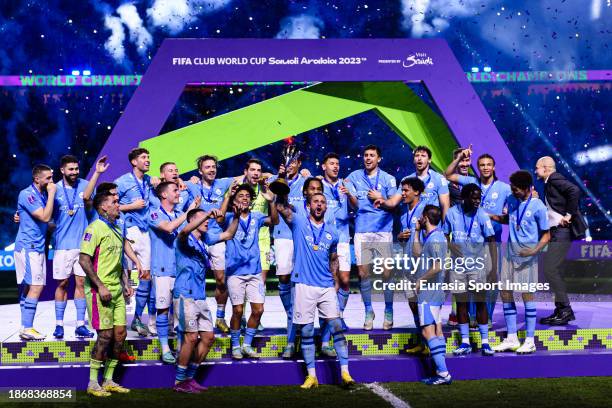 Kyle Walker of Manchester City rises the winners trophy with his teammates after winning Fluminense during the FIFA Club World Cup Final match...