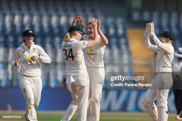 Annabel Sutherland of Australia celebrates the wicket of Pooja Vastrakar of India during day three of the Women's Test Match between India and...