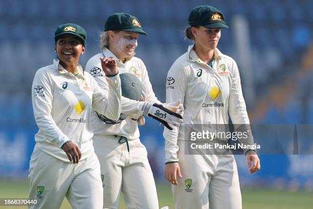 Players of Australia walk back during day three of the Women's Test Match between India and Australia at Wankhede Stadium on December 23, 2023 in...