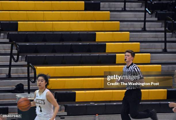 The bleachers in the gym had some sections that had much less attendees than the boys game that finished 45 minutes earlier.This view was taken of...