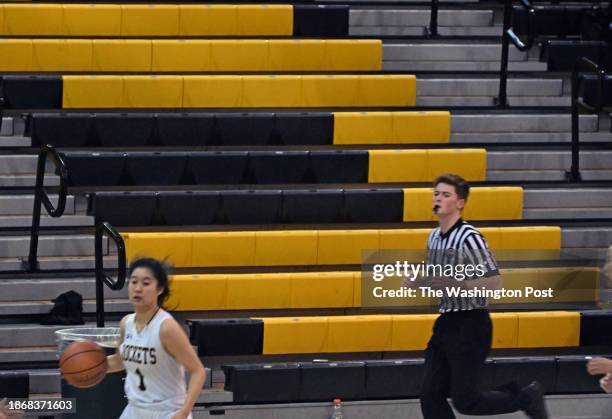 The bleachers in the gym had some sections that had much less attendees than the boys game that finished 45 minutes earlier.This view was taken of...