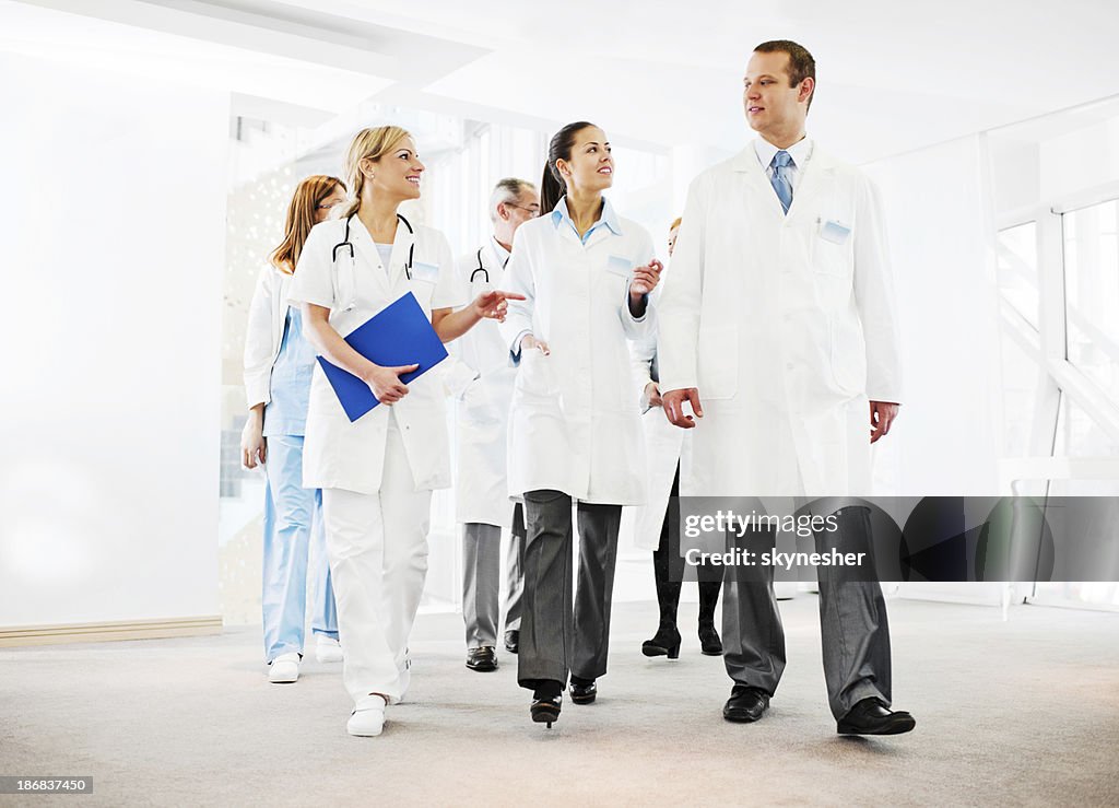 Group of successful doctors talking.