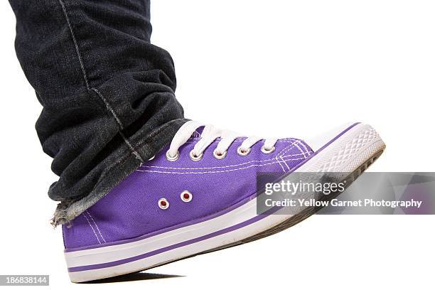 purple shoe stepping - trainer cutout stock pictures, royalty-free photos & images