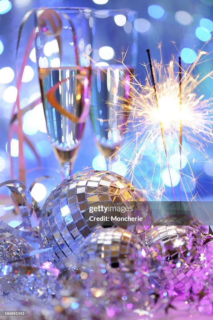 Party decoration with disco balls and fire sparkler