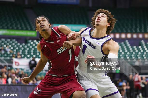 Daniel Hankins-Sanford of the Massachusetts Minutemen and Thomas Oosterbroek of the Portland Pilots get tangled up during a free throw attempt during...