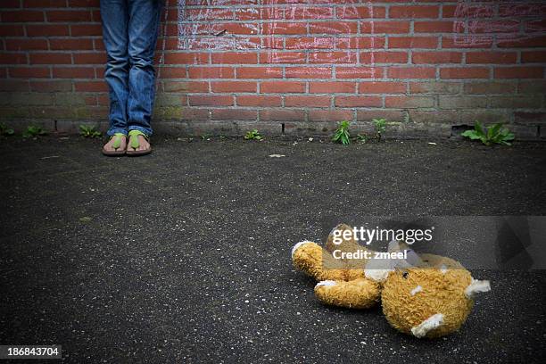 thrown away teddy bear - children violence stock pictures, royalty-free photos & images