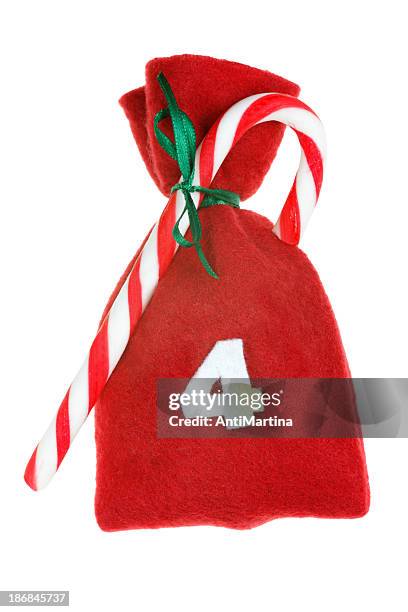 red christmas bag for advent calendar isolated on white - christmas calendar stockfoto's en -beelden