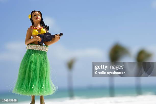 hula dancer, figurine on beach - hula dancing stock pictures, royalty-free photos & images