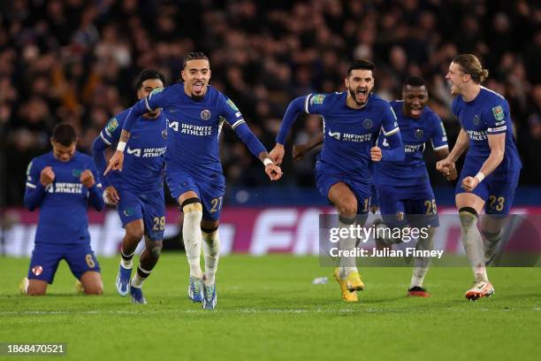 Malo Gusto and team mates of Chelsea celebrate after Djordje Petrovic of Chelsea saves a penalty taken by Matt Ritchie of Newcastle United during a...