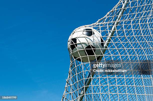 football goes in the net and makes a goal - international team soccer stock pictures, royalty-free photos & images