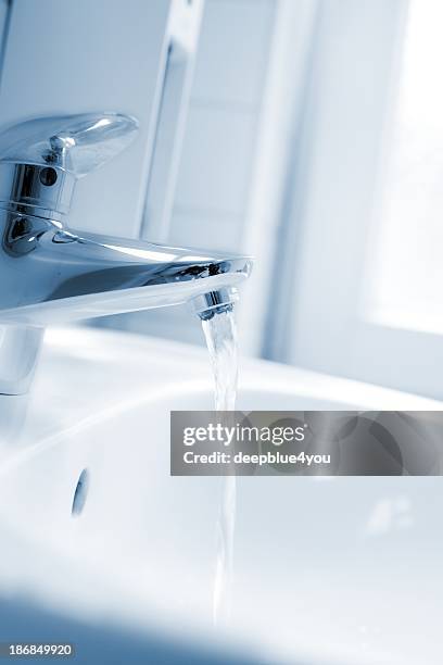 running faucet - in bath soft focused - running water bath stock pictures, royalty-free photos & images