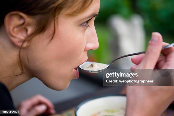 eating - soup on spoon stock pictures, royalty-free photos & images