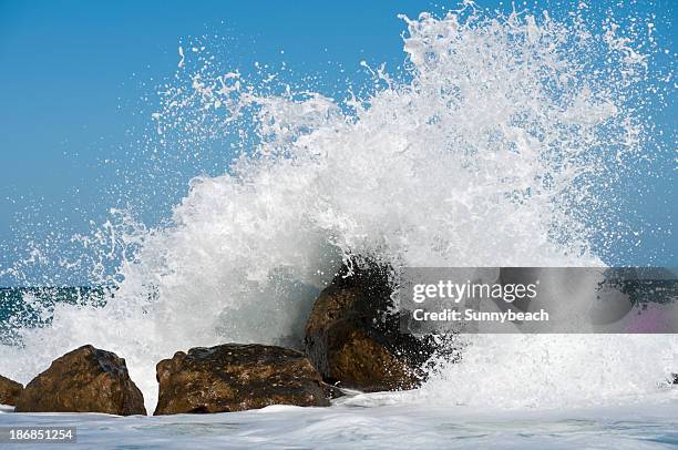 storm surf - waves crashing on rocks stock pictures, royalty-free photos & images