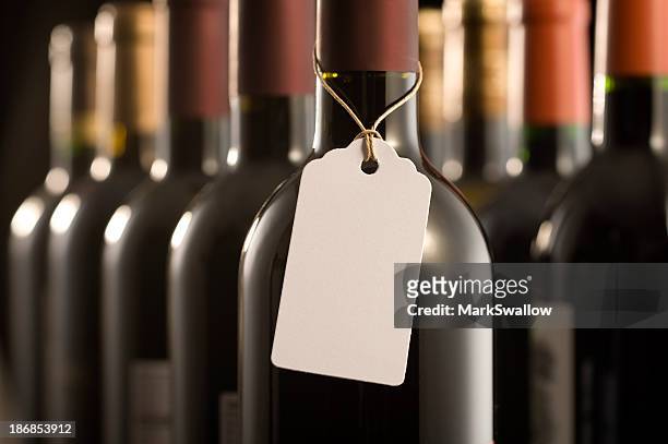 wine bottles and label - price tag stock pictures, royalty-free photos & images