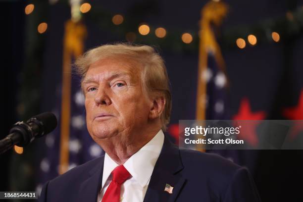 Republican presidential candidate and former U.S. President Donald Trump looks on during a campaign event on December 19, 2023 in Waterloo, Iowa....