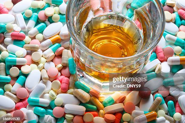 alcohol and prescription medication - tablet alcohol stock pictures, royalty-free photos & images