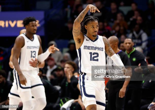 Ja Morant of the Memphis Grizzlies looks on while playing the New Orleans Pelicans at Smoothie King Center on December 19, 2023 in New Orleans,...