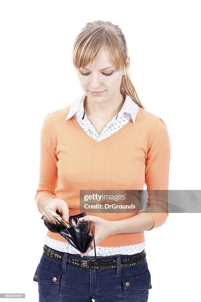 Young woman counting money in her wallet