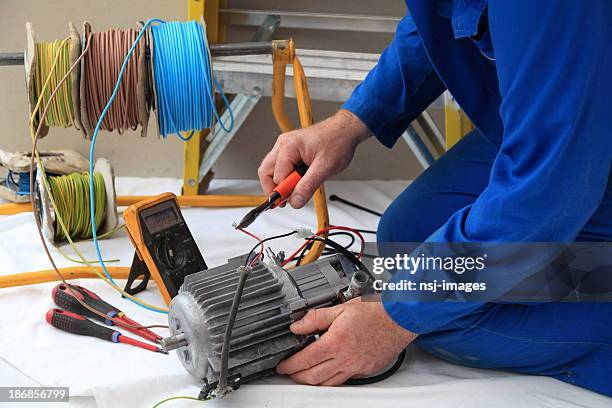 electrician at work. - water pump stock pictures, royalty-free photos & images