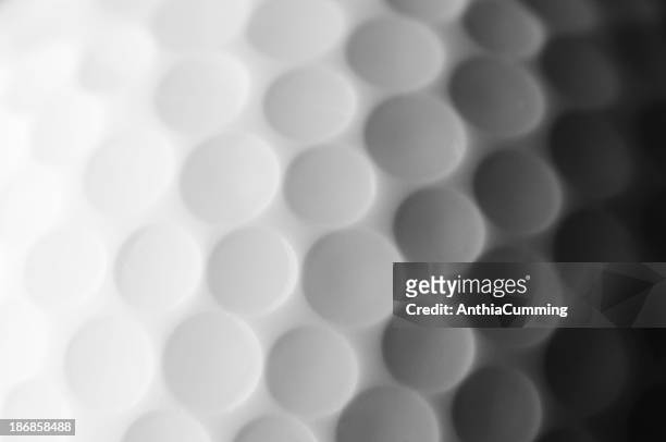 a close up shot of a golf ball, white and fade to dark gray - golf ball stock pictures, royalty-free photos & images