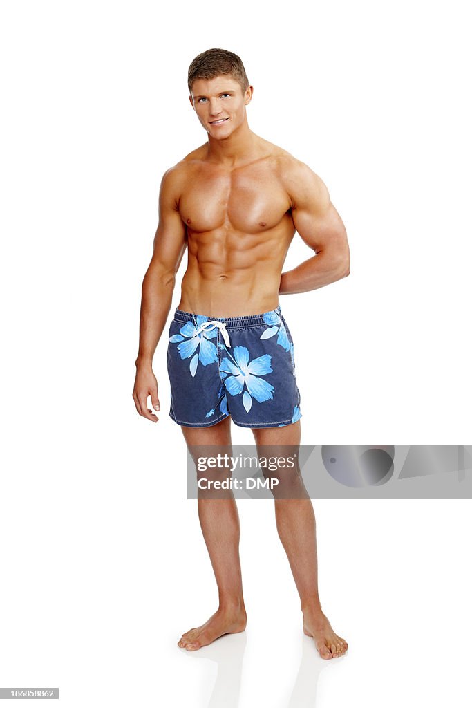 Muscular Young Man in Swimming Trunks