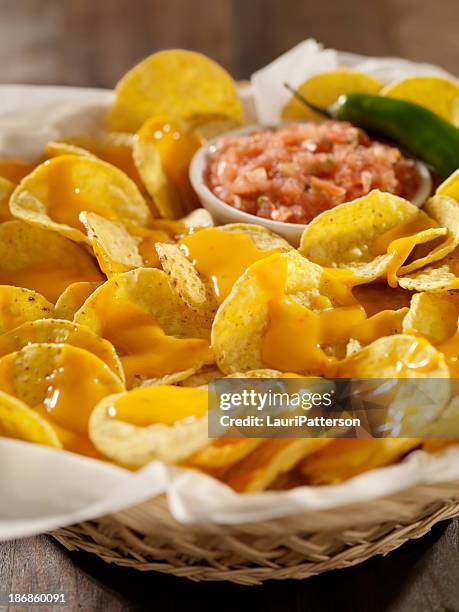 nachos with cheese sauce and salsa - cheese sauce stock pictures, royalty-free photos & images
