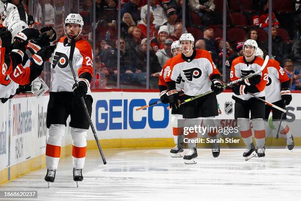 Ryan Poehling of the Philadelphia Flyers celebrates with the bench after scoring a goal during the second period against the New Jersey Devils at...