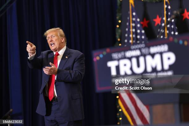 Republican presidential candidate and former U.S. President Donald Trump gestures as he wraps up a campaign event on December 19, 2023 in Waterloo,...