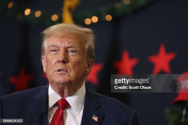 Republican presidential candidate and former U.S. President Donald Trump looks on during a campaign event on December 19, 2023 in Waterloo, Iowa....