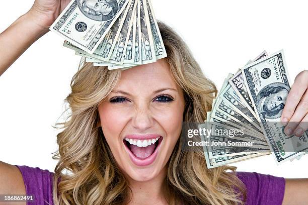 excited young woman holding money - twenty us dollar note stock pictures, royalty-free photos & images