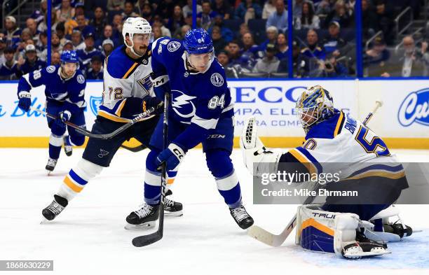Jordan Binnington of the St. Louis Blues stops a shot from Tanner Jeannot of the Tampa Bay Lightning in the second period during a game at Amalie...