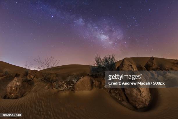 scenic view of desert against sky at night,fujairah,united arab emirates - fujairah stock pictures, royalty-free photos & images