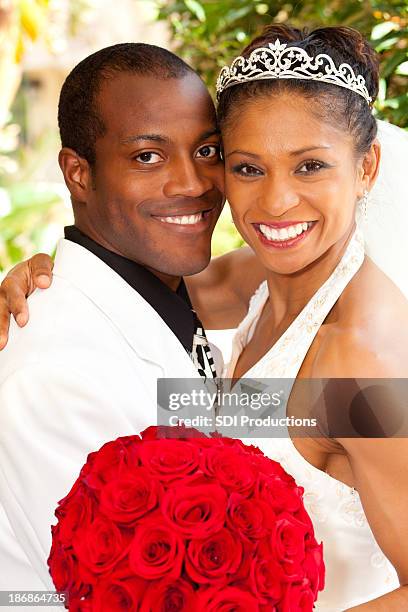 bride and groom posing together at outdoor wedding - couple portrait soft stock pictures, royalty-free photos & images