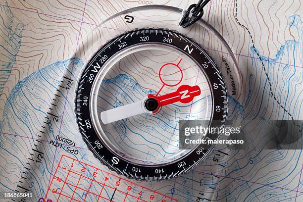 compass on topographic maps. - compass north stock pictures, royalty-free photos & images