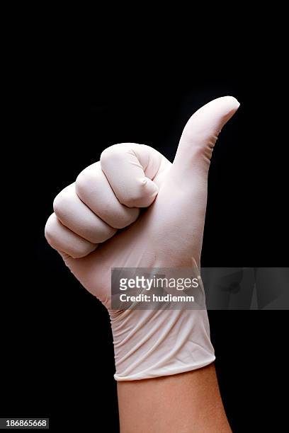 thumbs up! - surgical glove stock pictures, royalty-free photos & images