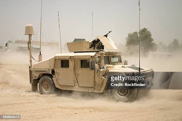 moving humvee - military vehicle stock pictures, royalty-free photos & images
