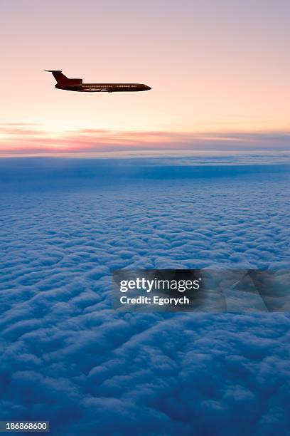sunrise flight - airplane stock pictures, royalty-free photos & images