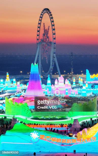 Aerial view of tourists visiting the 25th Harbin Ice and Snow World on December 18, 2023 in Harbin, Heilongjiang Province of China. The 25th Harbin...