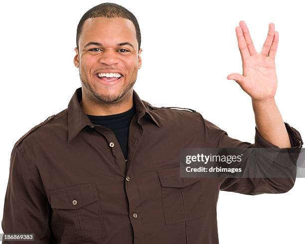 smiling man gives vulcan salute - vulcan salute stock pictures, royalty-free photos & images