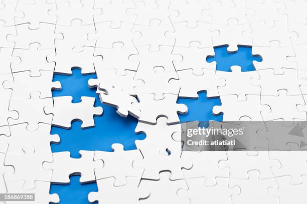 scattered jigsaw puzzle - missing jigsaw piece stock pictures, royalty-free photos & images