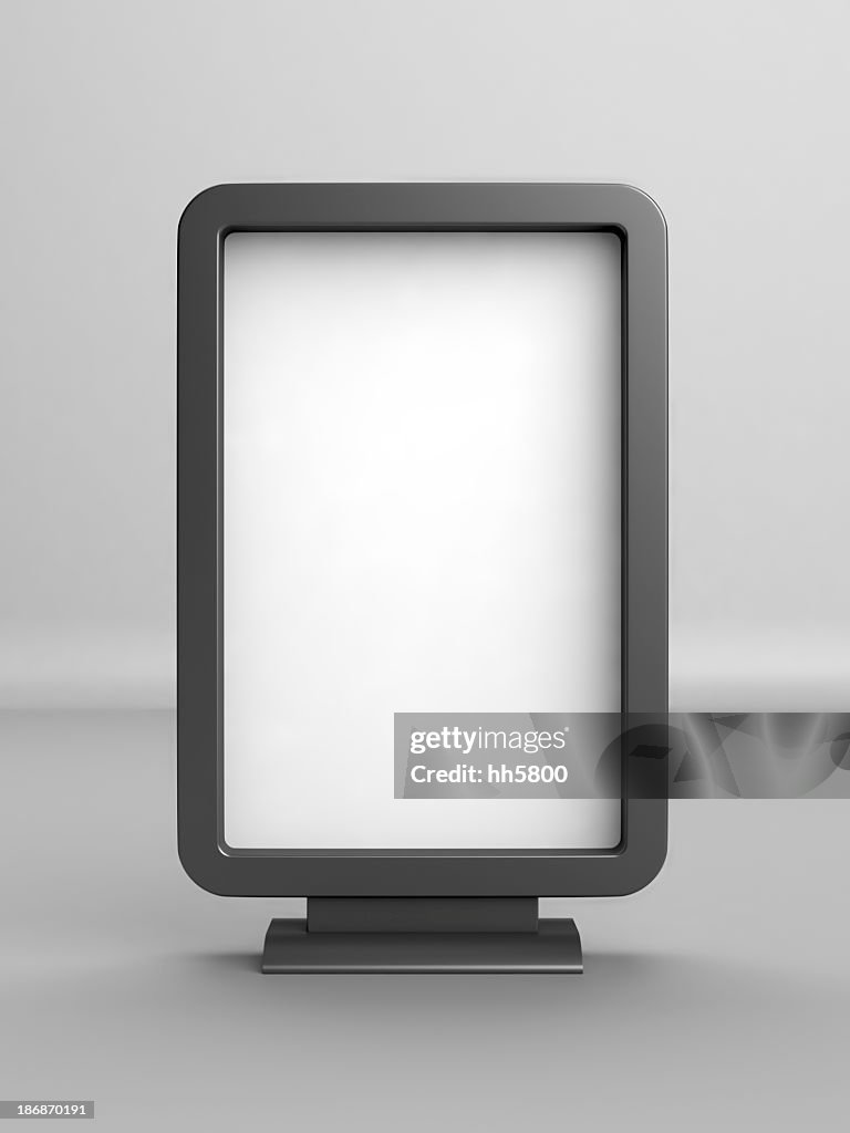 A white blank advertising board with black borders and stand