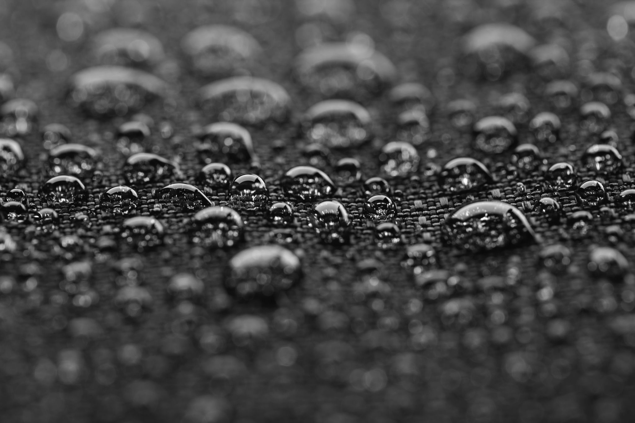 Waterproof textile after rain - covered with water drops Waterproof textile after rain - covered with water drops