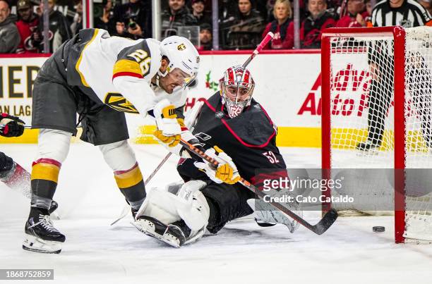 William Carrier of the Vegas Golden Knights scores a goal against Pyotr Kochetkov of the Carolina Hurricanes during the third period at PNC Arena on...