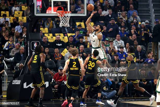 Jayson Tatum of the Boston Celtics goes up for a shot tate Warriors in the first half at Chase Center on December 19, 2023 in San Francisco,...