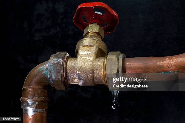 leaking copper water pipe and stopcock valve - water leak stock pictures, royalty-free photos & images