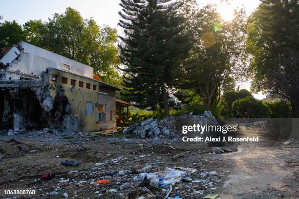 Nirit Hunwald, a Kibbutz Be’eri nurse, walks with a friend as they visit destroyed homes as she returns to her kibbutz for the first time since the...